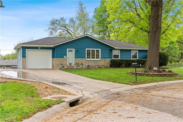 single story home with an attached garage, concrete driveway, a front lawn, and brick siding