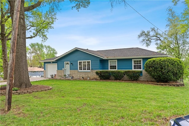 ranch-style home featuring a garage, driveway, and a front lawn
