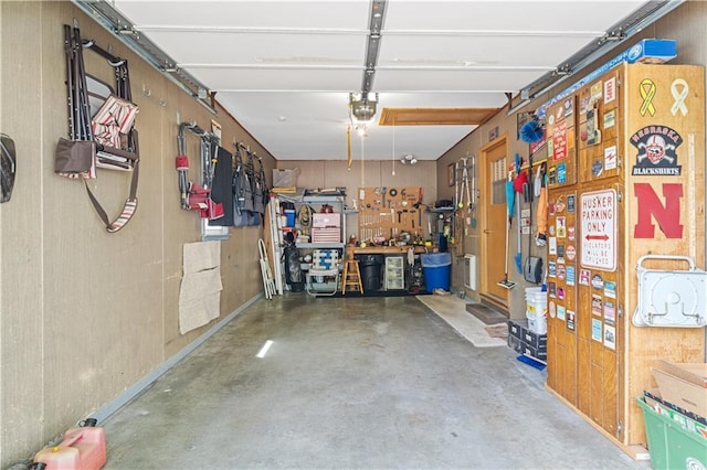 garage featuring a workshop area and a garage door opener