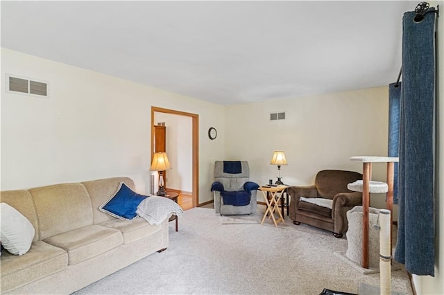 carpeted living area featuring visible vents