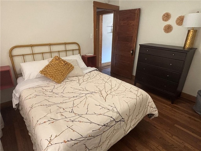 4019 Holly St, Kansas City, MO 64111 - bedroom featuring wood finished floors