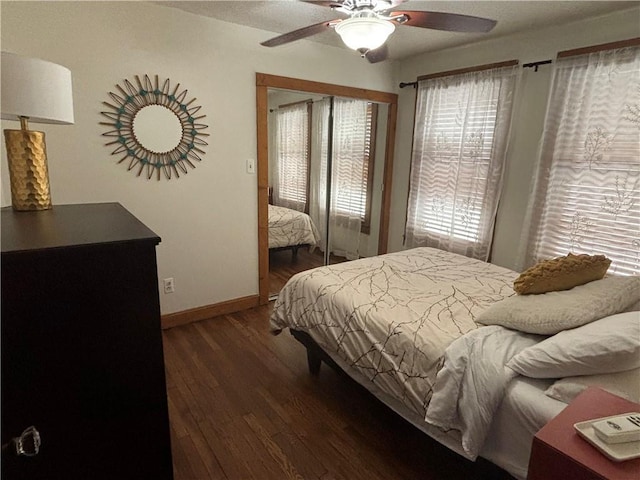 4019 Holly St, Kansas City, MO 64111 - bedroom with wood finished floors, baseboards, and ceiling fan