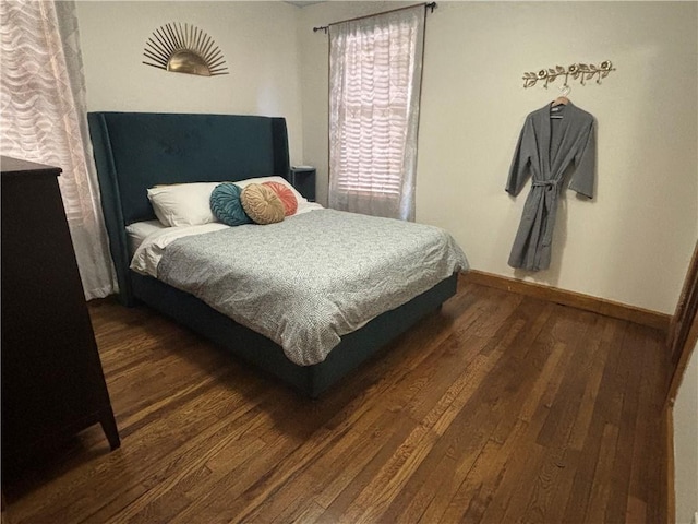 4019 Holly St, Kansas City, MO 64111 - bedroom with wood finished floors and baseboards