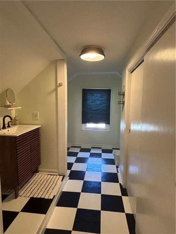 4019 Holly St, Kansas City, MO 64111 - hallway with light floors and vaulted ceiling