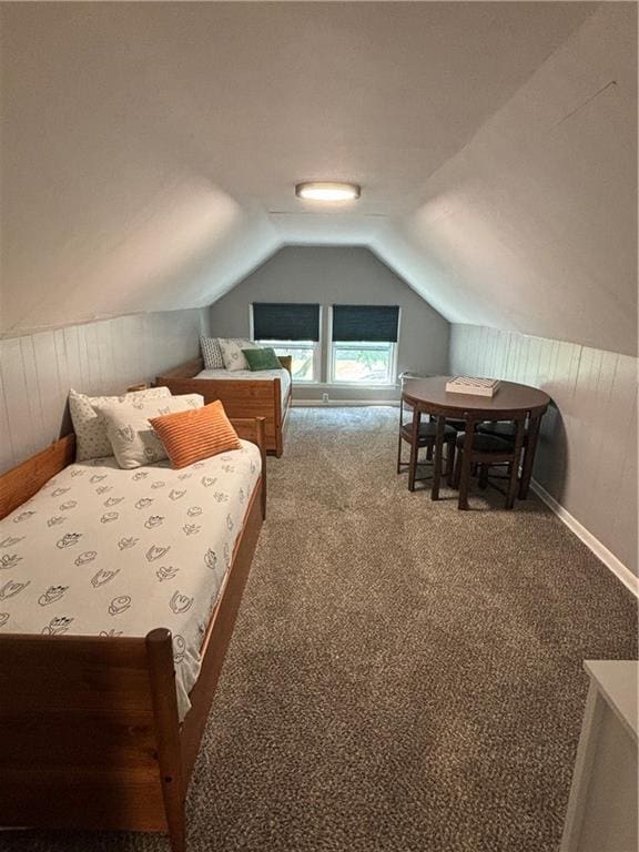 4019 Holly St, Kansas City, MO 64111 - carpeted bedroom with lofted ceiling and wooden walls