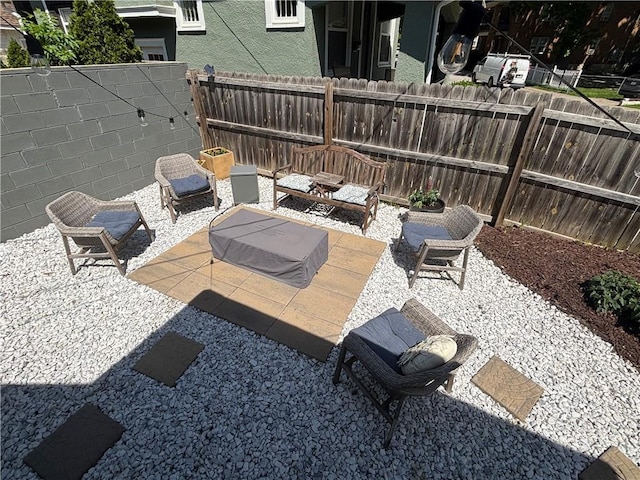 4019 Holly St, Kansas City, MO 64111 - fenced backyard with a patio area