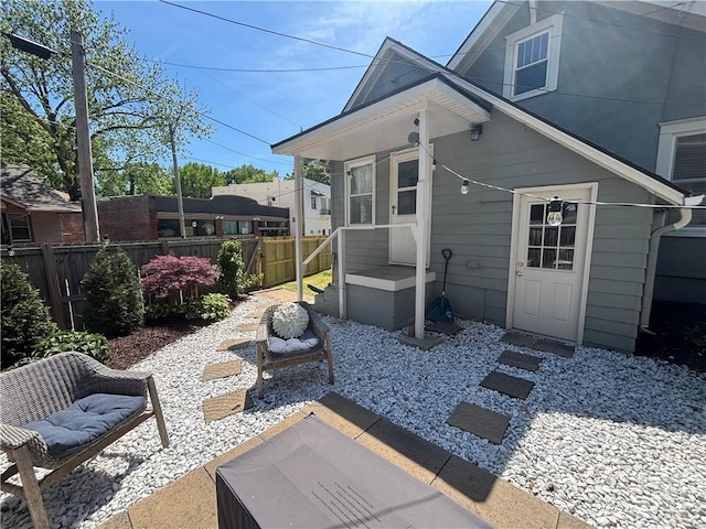 4019 Holly St, Kansas City, MO 64111 - rear view of property with a patio