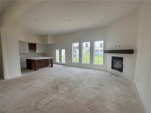2211 Prairie Creek Dr, Kearney, MO 64060 - unfurnished living room with a glass covered fireplace and baseboards