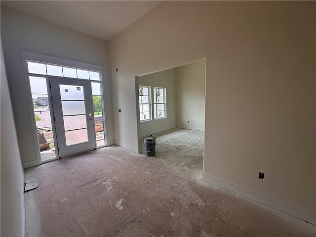 2211 Prairie Creek Dr, Kearney, MO 64060 - foyer entrance featuring baseboards and high vaulted ceiling