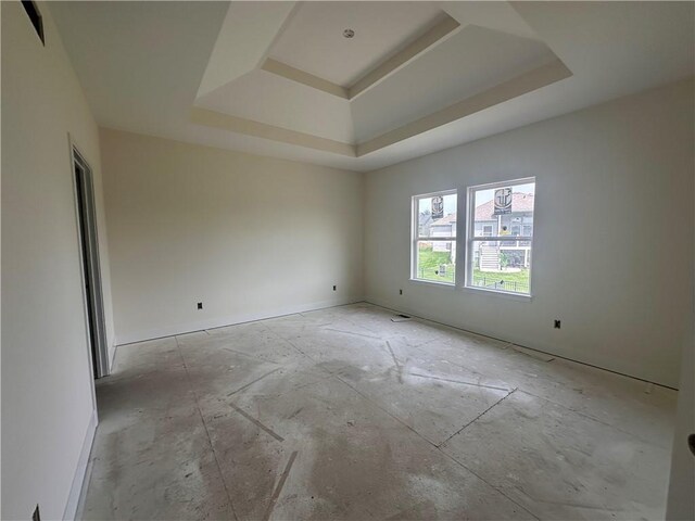 2211 Prairie Creek Dr, Kearney, MO 64060 - empty room featuring a raised ceiling and baseboards