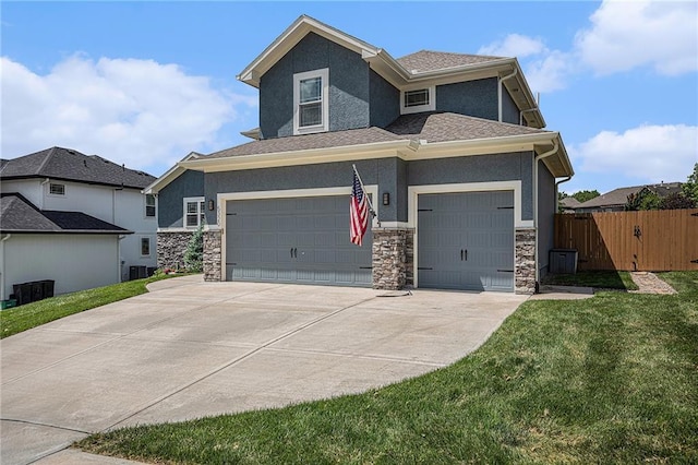 5320 N 101st Ter, Kansas City, KS 66109 - view of front of house featuring stone siding, stucco siding, concrete driveway, and a garage