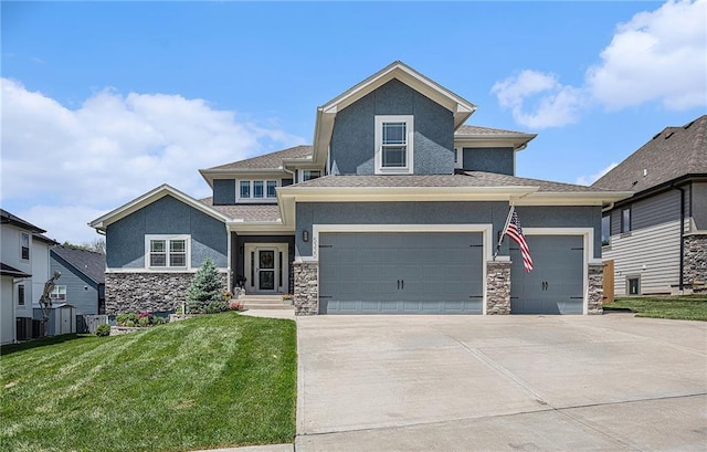 5320 N 101st Ter, Kansas City, KS 66109 - view of front of house featuring stone siding, stucco siding, a front yard, and driveway