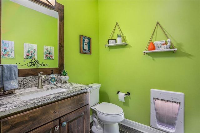 5320 N 101st Ter, Kansas City, KS 66109 - half bath with heating unit, toilet, vanity, baseboards, and tile patterned flooring