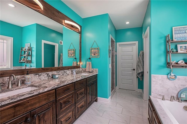 5320 N 101st Ter, Kansas City, KS 66109 - bathroom featuring marble finish floors, a garden tub, a stall shower, double vanity, and baseboards