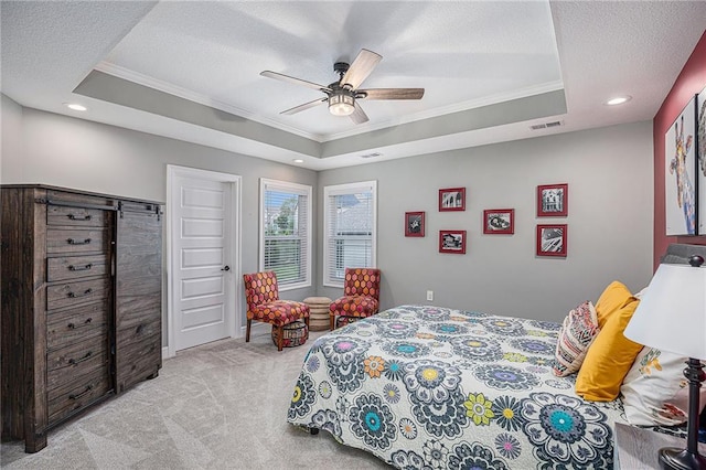 5320 N 101st Ter, Kansas City, KS 66109 - bedroom with crown molding, a tray ceiling, light carpet, a textured ceiling, and recessed lighting