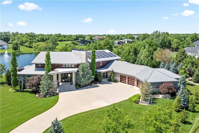 10712 W 165th St, Overland Park, KS 66221 - aerial view of property and surrounding area featuring a large body of water and a tree filled landscape