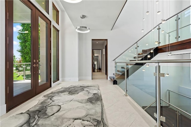 10712 W 165th St, Overland Park, KS 66221 - entrance foyer with healthy amount of natural light, stairway, french doors, and baseboards