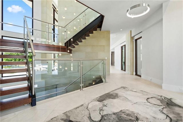 10712 W 165th St, Overland Park, KS 66221 - stairway with a high ceiling and baseboards