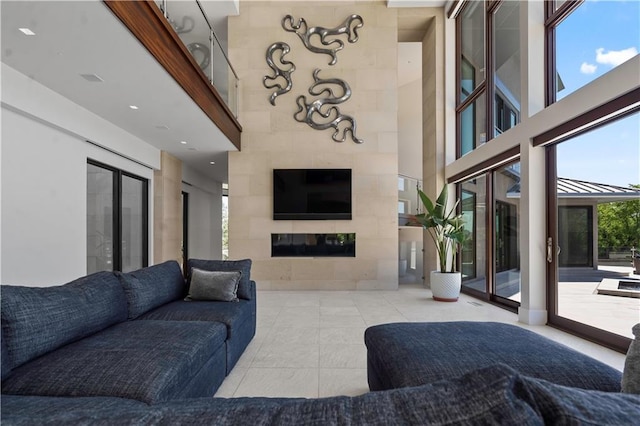 10712 W 165th St, Overland Park, KS 66221 - tiled living room with a fireplace and a high ceiling