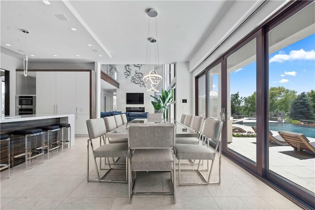 10712 W 165th St, Overland Park, KS 66221 - dining room featuring light tile patterned flooring, plenty of natural light, a chandelier, and recessed lighting