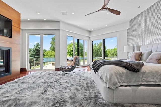 10712 W 165th St, Overland Park, KS 66221 - bedroom with access to exterior, multiple windows, a fireplace, recessed lighting, and ceiling fan