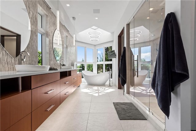 10712 W 165th St, Overland Park, KS 66221 - full bath with double vanity, a shower stall, a soaking tub, and tile patterned flooring