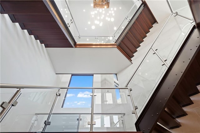 10712 W 165th St, Overland Park, KS 66221 - staircase with a chandelier