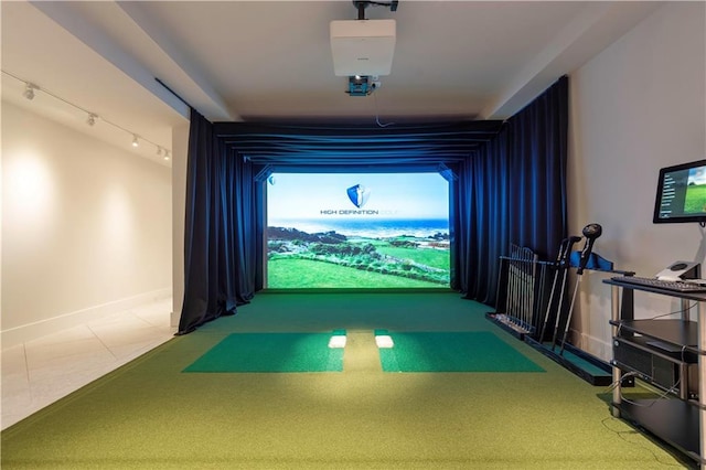 10712 W 165th St, Overland Park, KS 66221 - playroom with golf simulator, track lighting, and baseboards