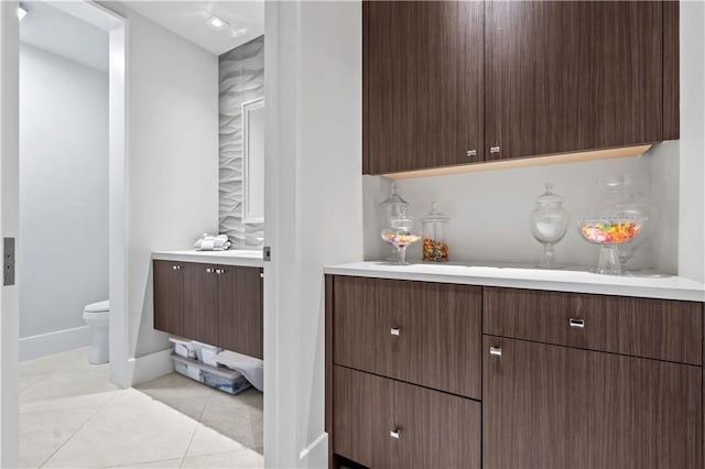 10712 W 165th St, Overland Park, KS 66221 - bathroom featuring vanity, toilet, baseboards, and tile patterned flooring