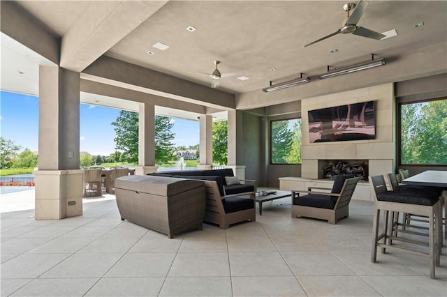 10712 W 165th St, Overland Park, KS 66221 - view of patio with an outdoor living space with a fireplace and ceiling fan
