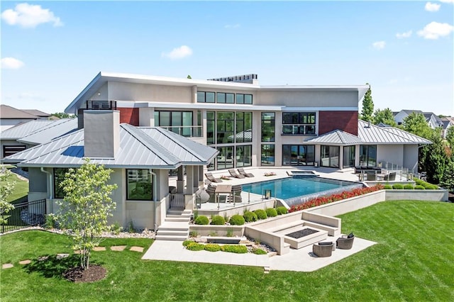 10712 W 165th St, Overland Park, KS 66221 - back of house with a patio, an outdoor pool, a standing seam roof, metal roof, and a vegetable garden