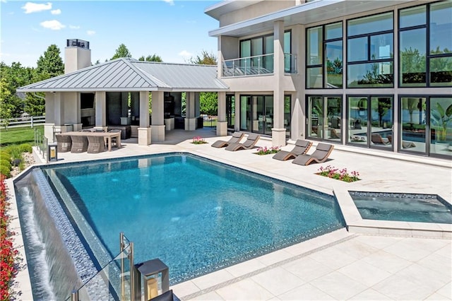 10712 W 165th St, Overland Park, KS 66221 - swimming pool featuring a patio area, an in-ground hot tub, and outdoor lounge area