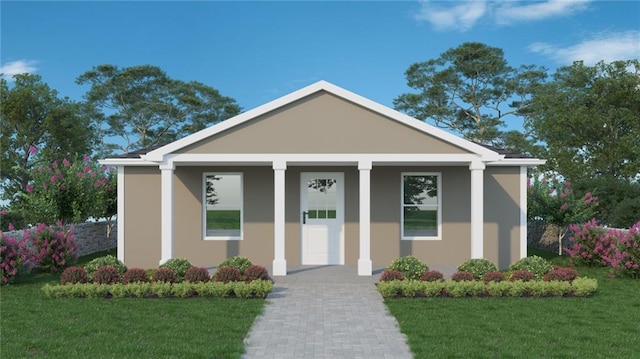 view of front of property featuring covered porch, a front lawn, and stucco siding