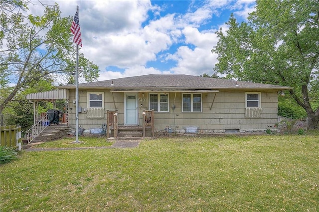 view of front of house featuring a front lawn and a carport