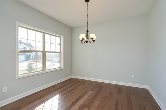 18256 W 166th St, Olathe, KS 66062 - empty room with a chandelier and dark wood-style flooring