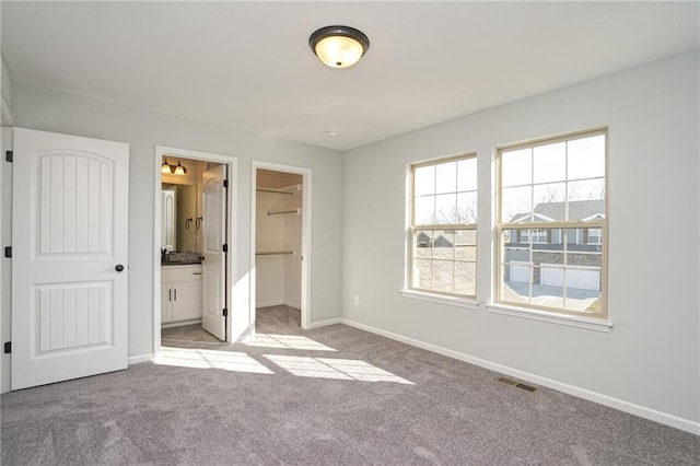 18256 W 166th St, Olathe, KS 66062 - unfurnished bedroom with light colored carpet, a walk in closet, and ensuite bath