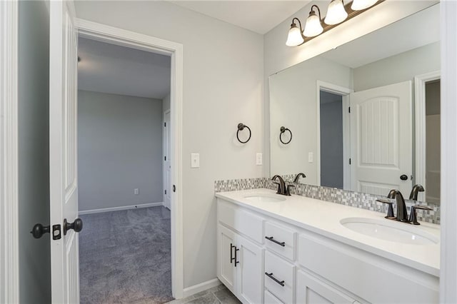 18256 W 166th St, Olathe, KS 66062 - bathroom featuring double vanity and baseboards