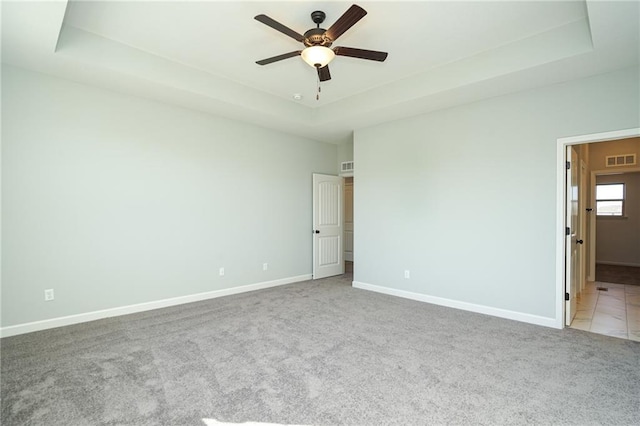 18256 W 166th St, Olathe, KS 66062 - spare room with a raised ceiling, carpet floors, and ceiling fan