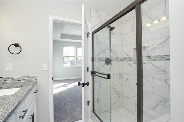 18256 W 166th St, Olathe, KS 66062 - full bathroom featuring a marble finish shower, vanity, and a raised ceiling