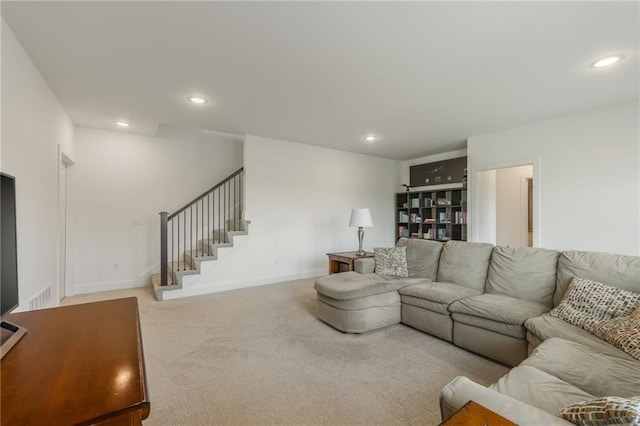 carpeted living room with recessed lighting, baseboards, and stairway