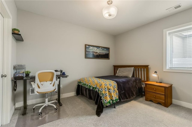 bedroom with visible vents, carpet flooring, and baseboards