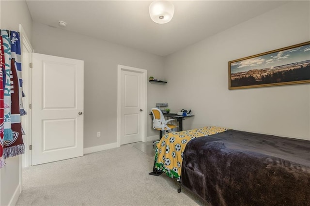carpeted bedroom featuring baseboards