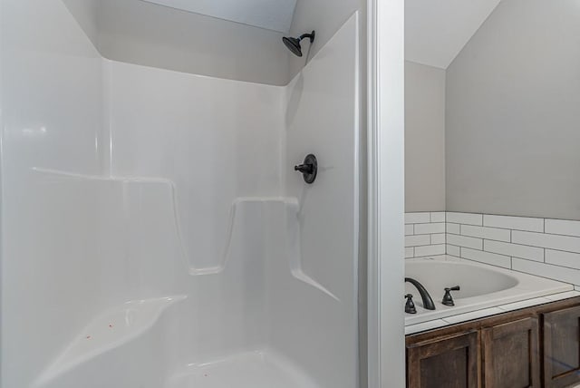 full bath featuring a bath and walk in shower