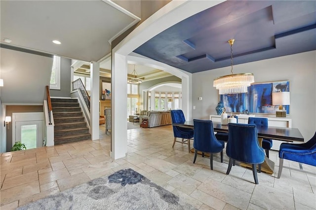 dining area featuring crown molding, stone tile floors, stairway, recessed lighting, and a notable chandelier