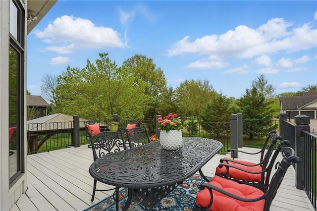 deck with outdoor dining space
