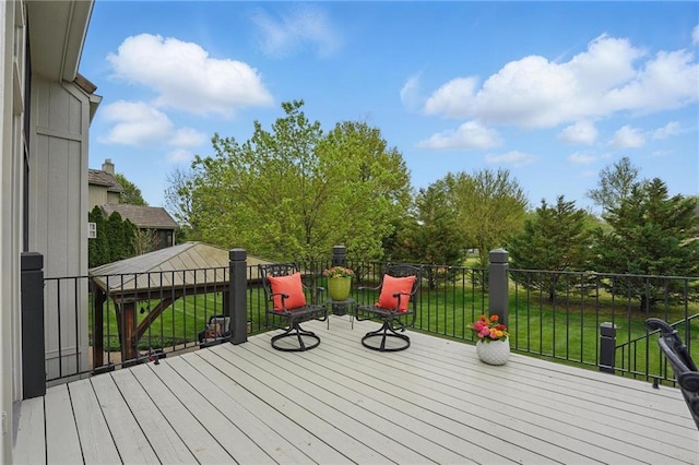 deck featuring a yard