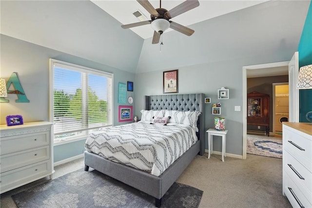 bedroom with carpet floors, baseboards, and lofted ceiling