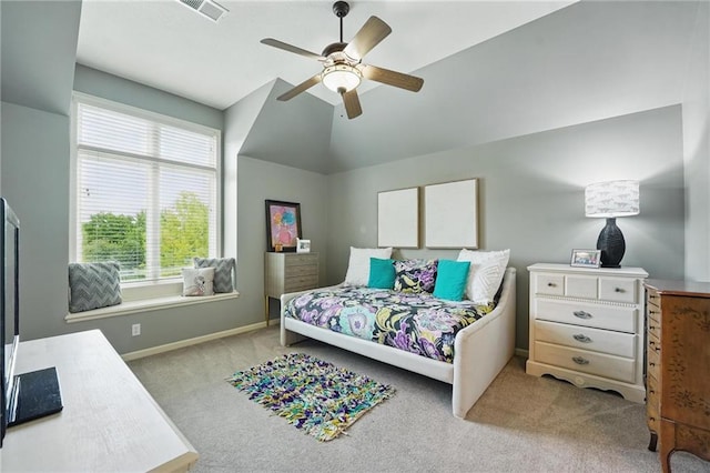 bedroom featuring visible vents, lofted ceiling, baseboards, light colored carpet, and a ceiling fan