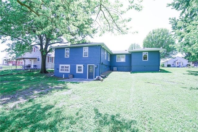 502 W Broadway St, Higginsville, MO 64037 - rear view of house featuring a patio