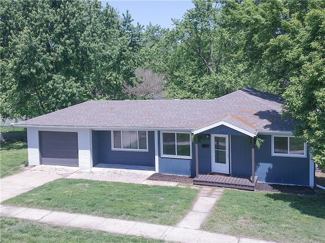 502 W Broadway St, Higginsville, MO 64037 - ranch-style home featuring roof with shingles, a front lawn, an attached garage, and concrete driveway